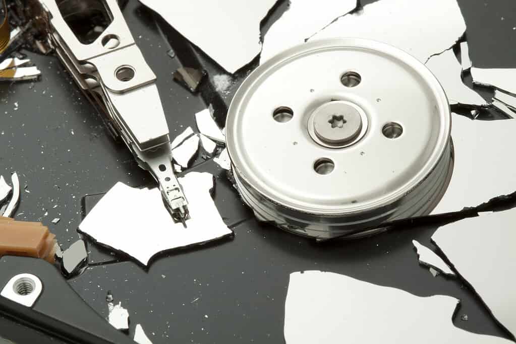 Broken hard drive disk by hammer.